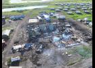 Photo courtesy Tapraq Rock/Dylan Saunders DESTROYED—Noxious smoke still rises from smoldering debris four days after a fire destroyed 10 school buildings and damaged seven others.