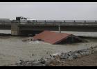 A house, only used for storage, was washed off Belmont Point and became lodged upriver at the Snake River bridge. 