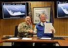 SIGN HERE — Colonel Jeffrey Palazzini, commander of the Alaska District of the U.S. Army Corps of Engineers, shakes hands with Nome Mayor John Handeland after both signed the project partnership agreement for the port expansion.