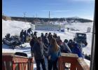 Volunteers gather around Gerard Thiart as he arrived with Ed Stang in the White Mountain checkpoint. 